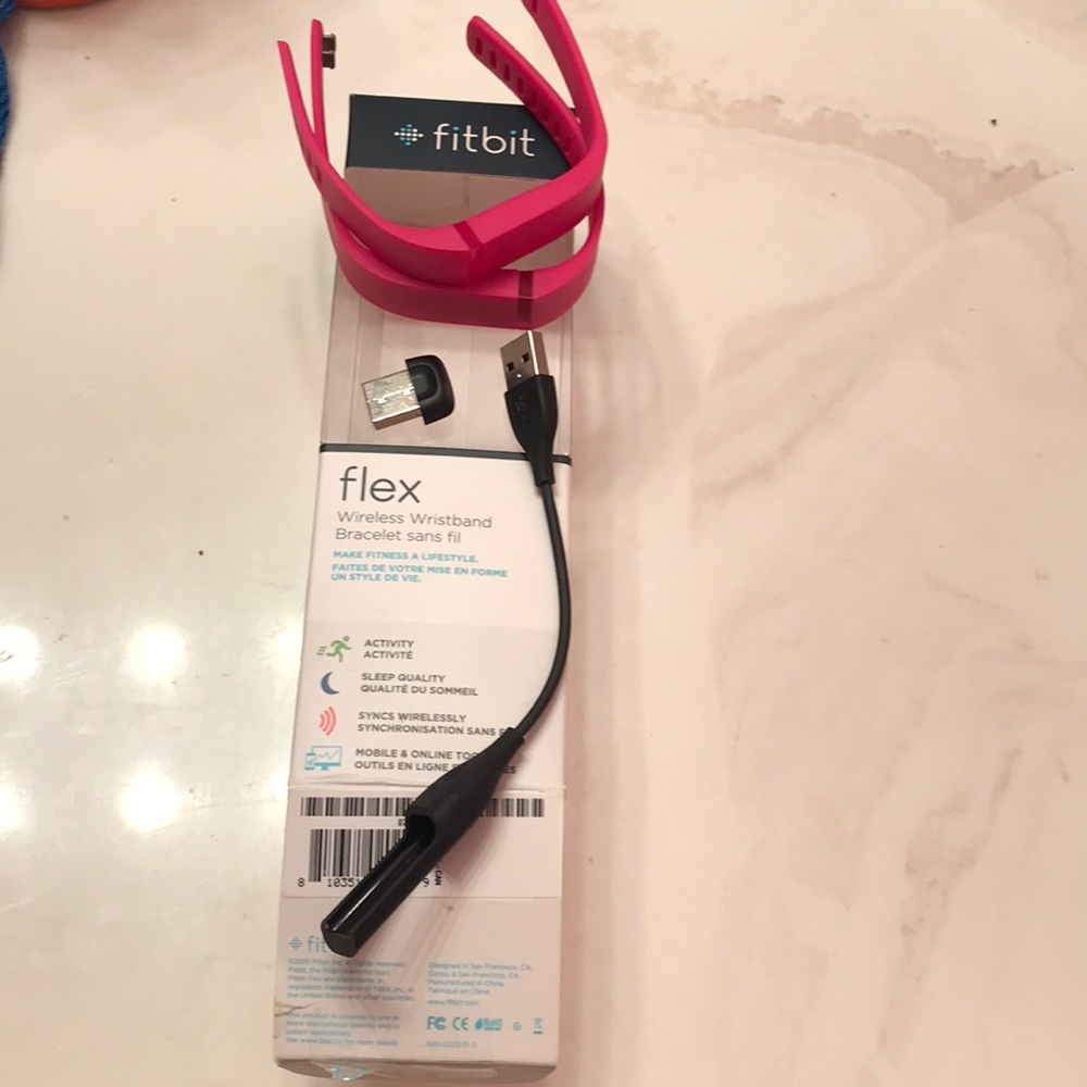 2 PINK FITBITS NEVER USED IT SMALL AND LARGE